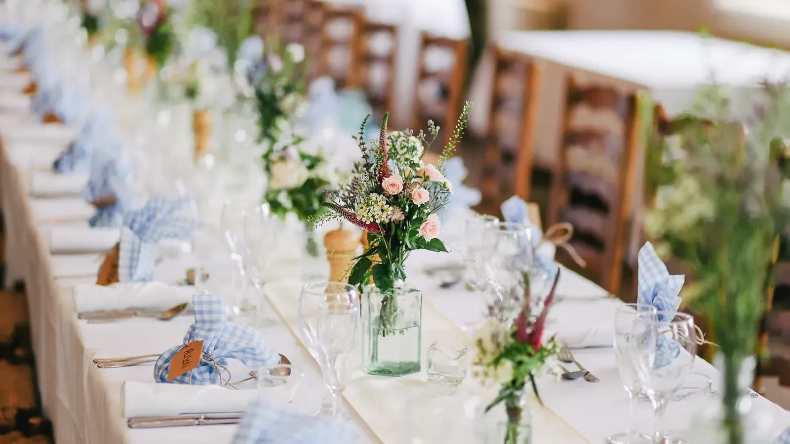 A blank event room transformed by Something Blue into a styled wedding reception.
