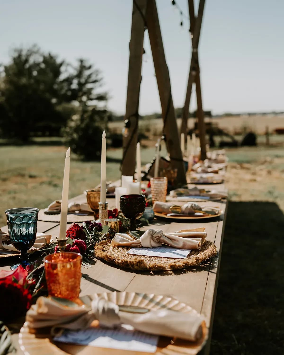 A wedding reception detail being set by the Something Blue coordination team.