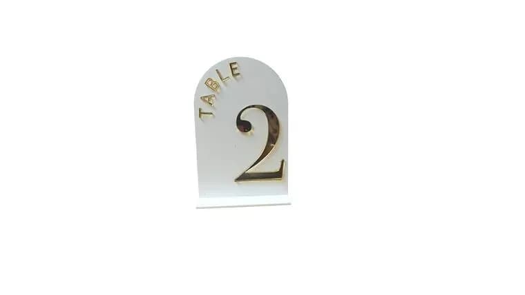 Acrylic White & Gold Table Numbers 1-25 — available to rent from Something Blue