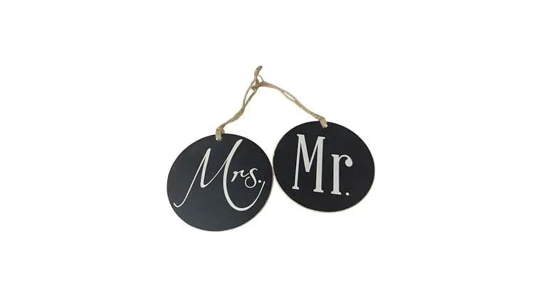 Black Wooden Circle "Mr. & Mrs." Sign — available to rent from Something Blue
